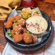 Lolita Fort Point signature dishes Crispy Queso PoppersBaja Shrimp QuesadillaPork Al Pastor Tacos